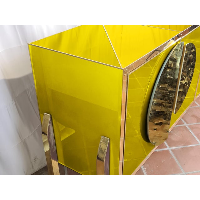 This exquisite four-door yellow modern sideboard is a masterpiece of Italian craftsmanship. Handcrafted with meticulous...