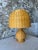 Bring warmth and natural texture into your space with this beautifully sculpted vintage rattan table lamp. Featuring a...