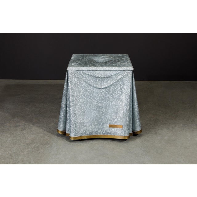 This exceptionally rare and high-sought after collectors item is the John Dickinson model #107 drape end table with...