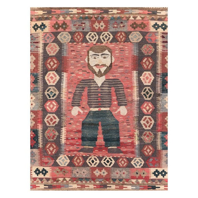 A vintage Turkish flatweave Kilim throw rug in square format handmade during the mid-20th century with a pictorial design...
