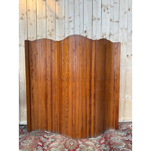 Solid pine slatted screen, Baumann style, circa 1950s. The screen is made of tightly fitted slats mounted on a flexible...