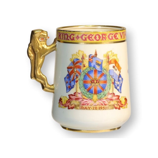 Commemorative porcelain mug issued for the coronation of King George VI, dated May 12, 1937. Produced in England with...