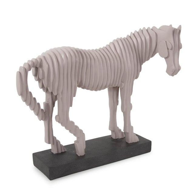This minimalist approach to the shape and form of a standard race horse creates a modern twist to an old classic. The...