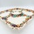 A wonderfully exuberant vintage serving platter in the Della Robbia tradition, richly decorated with dimensional fruit and...