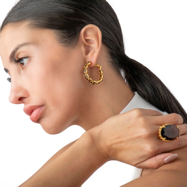 Introducing a new design, the Elaine Hoops are smooth, sleek, and crafted for the modern metropolitan woman. Available in...