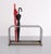 Very nice Bauhaus style umbrella stand. Chrome frame. RVS steel Drip tray. This piece is designed in the style of the...