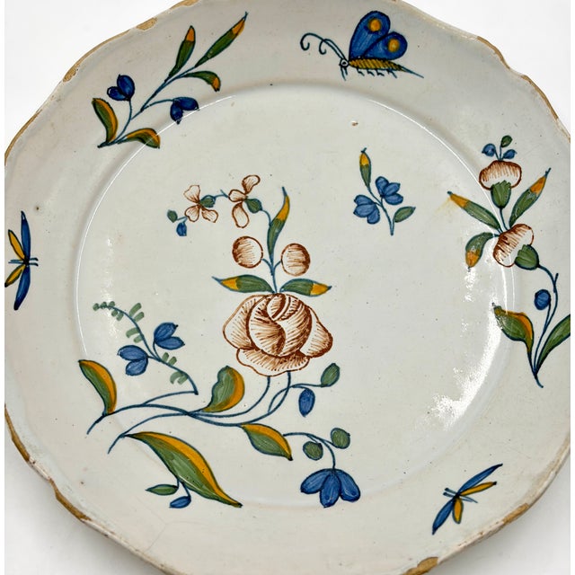 A gorgeous antique 18th-Century faience polychrome plate from the south-west region of France. This charming plate has...