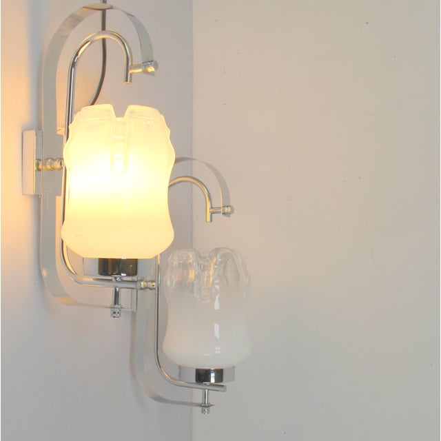 Italian Wall Lights in Chrome Plating and Glass, 1970s, Set of 2, in Very Good conditions. Designed 1970 to 1979 European...