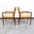 Pair of solid walnut arm chairs and tan vinyl upholstery (unmarked). Nice squared frames and sculptural elements...