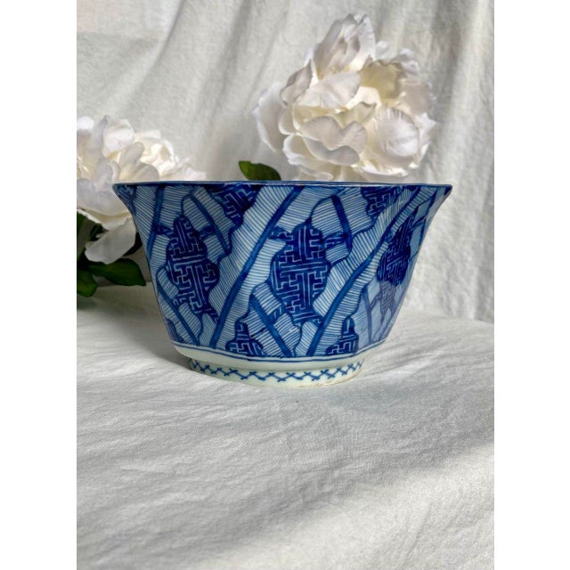 A striking Chinese blue and white octagonal porcelain bowl featuring a central qilin rendered in expressive underglaze...