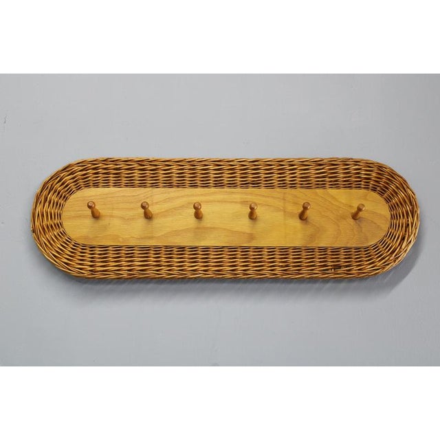 This Mid Century Modern wall-mounted coat rack was produced by ULUV and designed by Jan Kalous in Czechoslovakia during...