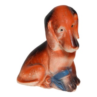 Vintage American Carved and Painted Chalkware Orange Puppy With Blue Bow Figurine For Sale