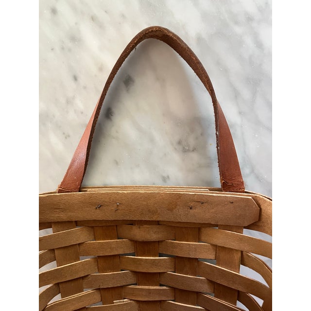 Vintage Longaberger wall hanging basket with leather handle. Split wood construction with decorative & functional nails....