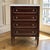 French Louis XVI Petite Mahogany Commode with Carrara Marble is beautifully tailored, finished in rich mahogany and topped...