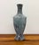 A striking vintage sculptural ceramic vase featuring a bold architectural silhouette inspired by Art Deco design with...