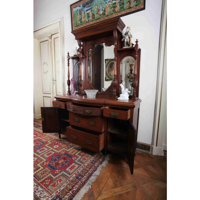 Mahogany chest of drawers decorated with carving and turning. The chest of drawers was made in the 1920s. The mirrors are...