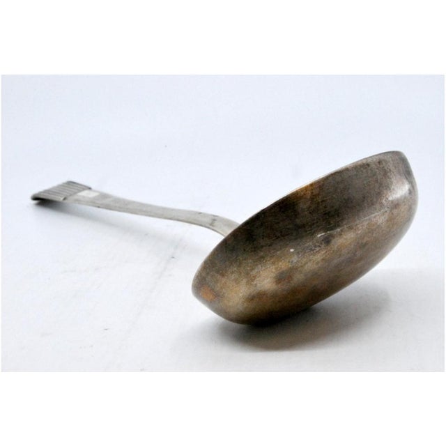Smooth Silver Soup Ladle with Embossed Handle, in Very Good conditions. Designed before 1890 This piece has an attribution...