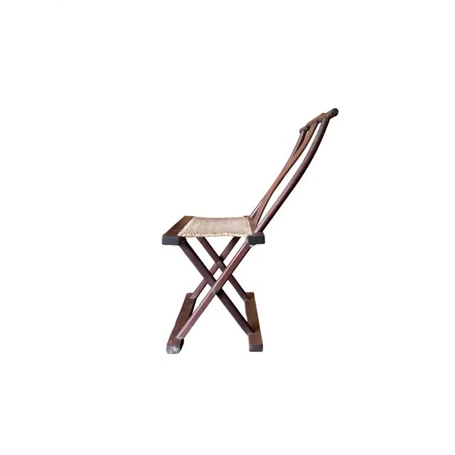 This folding chair from the early 20th Century crafted from a wood frame was once used by Chinese Travellers. The seat is...