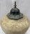 A striking decorative covered jar in the Chinoiserie taste, featuring a generously proportioned globular ceramic body with...