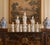 A serene grouping of seven blanc de chine figures depicting Quan Yin, the bodhisattva of compassion, rendered in softly...