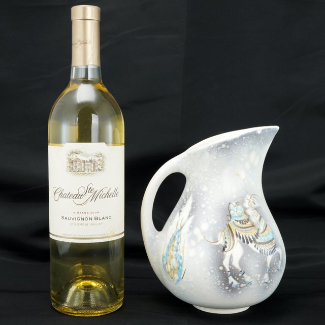 A hand painted snowing scene with caparisoned camels in all of their glory has a Matisse like quality. Hand painting on...