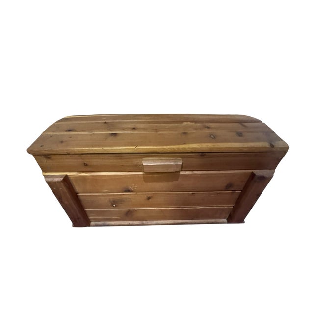 Handcrafted cedar keepsake chest box featuring warm natural wood tones, clean rustic lines and a hinged lift-top lid....