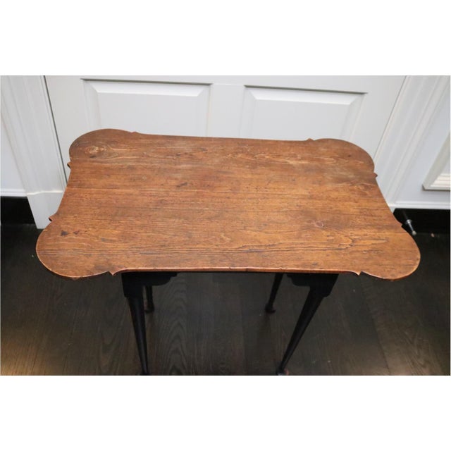 Vintage Queen Anne style side table in a warm, weathered pine finish with a distinctive porringer top with notched and...
