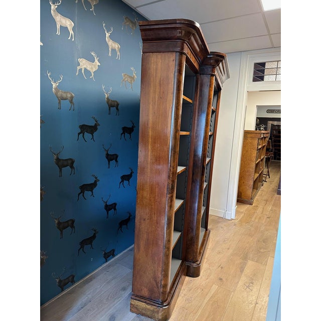 Beautiful burl walnut open bookcase from the Victorian era. The rounded corners are a typical Victorian feature. This is a...