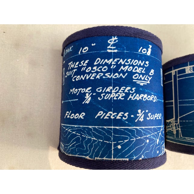 A pair of clip top sconce shades hand made from a set of vintage blueprint drawings of a ship. A perfect accent for a...