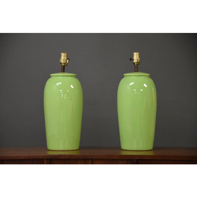 A pair of mid century modern green table lamps. They do not come with harps or shades. 7.5” diameter. 19.5” tall.