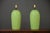 A pair of mid century modern green table lamps. They do not come with harps or shades. 7.5” diameter. 19.5” tall.