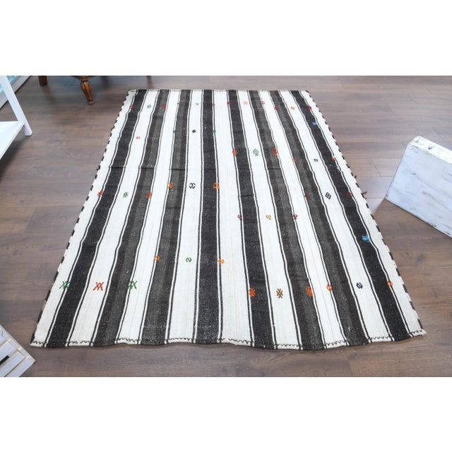 Vintage Turkish Hand-Knotted vintage rug is a semi-Vintage area kilim rug.'70s Eastern region of Turkey's unique rug is...