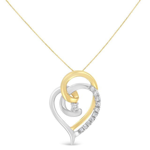 Here's a beautiful way to celebrate your love. With no shortage of flourishes, this loosely shaped heart pendant features...