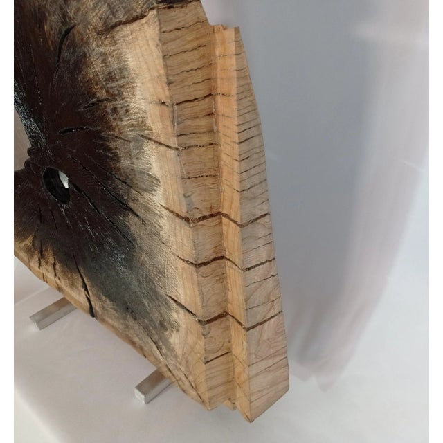 Sculpture (footprint) carved in oak wood, with mixed wood and aluminum technique. with this piece I want Do you have an...