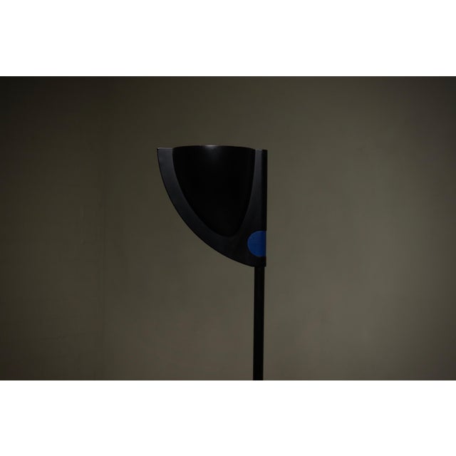 Postmodern floor lamp manufactured by Relco Milano in Italy during the 1980s. The piece features a heavy cast iron base...