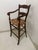 French Provincial Wood Bar Stool with Rush Seat. Made in 1970's. Dark wood finish with seagrass woven seat design.