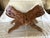An ornate hand carved book stand featuring a floral and leaf scroll design and made of mango wood. The piece, made in...