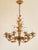 Gorgeous Italian gilt metal motif Hollywood Regency style chandelier with 6 lights. Featuring palm leaf motif on the...