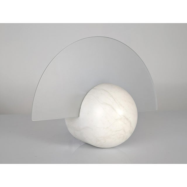 This exquisite 1970s wall sconce, inspired by the Art Deco style, is a design piece of great elegance. Crafted from...