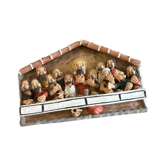 A rare and expressive Andean folk sculpture by Cristóbal Mamani, hand-formed in terracotta and depicting a remarkable...