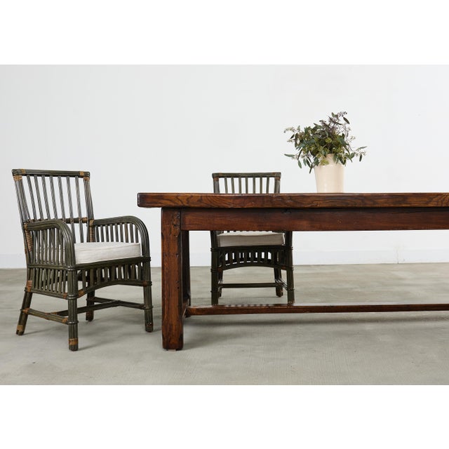 A substantial 19th century rustic country French oak farmhouse table of classical provincial style featuring a wide,...