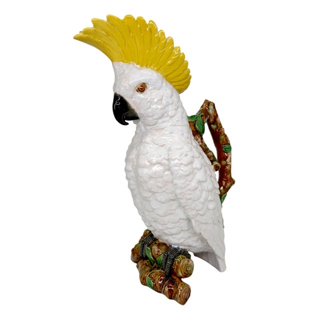 A William Brownfield Majolica Pitcher modeled as a cockatoo perched on a branch base with branch handle and green-glazed...