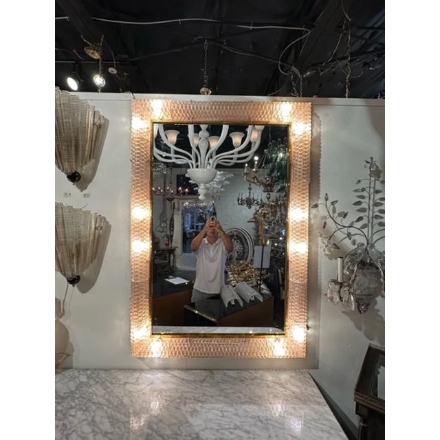 Fabulous Modern Murano blush glass and brass light up mirrors. These are sure to make a statement!