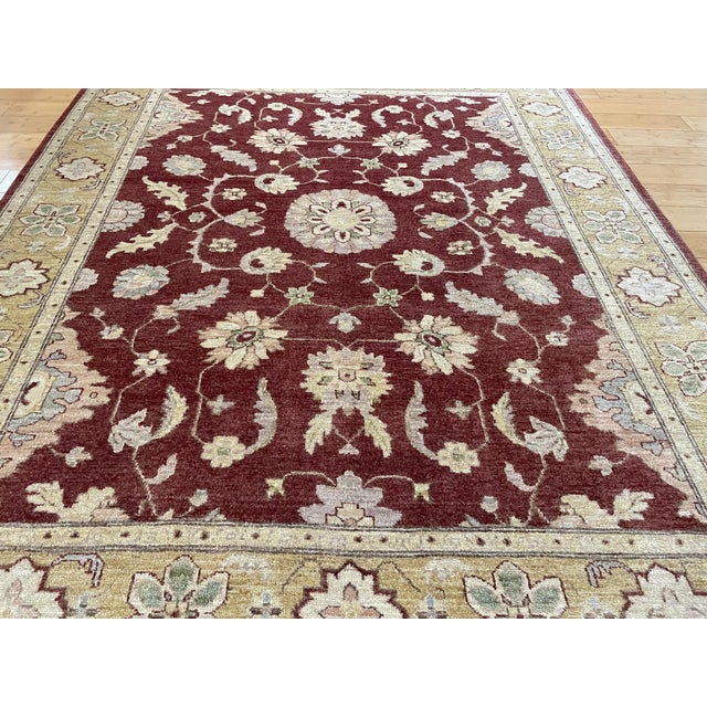 Afghan hand‑knotted wool rug in the timeless Sultanabad (Ziegler) design, showcasing an elegant arrangement of floral...