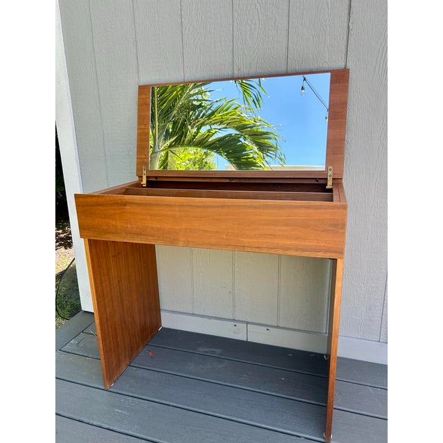 Quality, mid century Danish Modern teak vanity or desk. Flip top mirror with brass ring, pulls open to two sections for...