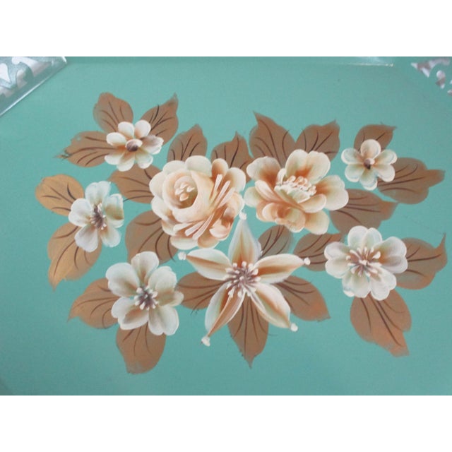 Vintage hand-painted mint green tole tray with a decorative reticulated boarder. The center is decorated with ivory and...