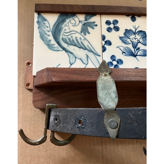 This handmade wooden pot holder or coat rack with Delft-like blue and white tiles adds a touch of vintage charm to any...