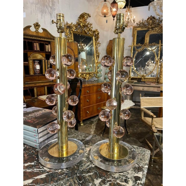 Pair of Modern Murano Pink glass and brass ball lamps. Circa 2000. A favorite of top designers.