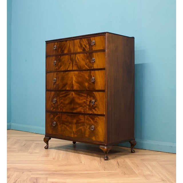 A mid-century chest of drawers by Beithcraft, dating to the early–mid 1950s. Constructed in walnut veneer with book-...