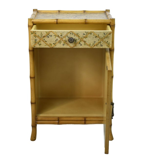 A faux bamboo cabinet decorated with a bird motif — a petite case with big chinoiserie charm. Use it as a bar cabinet,...